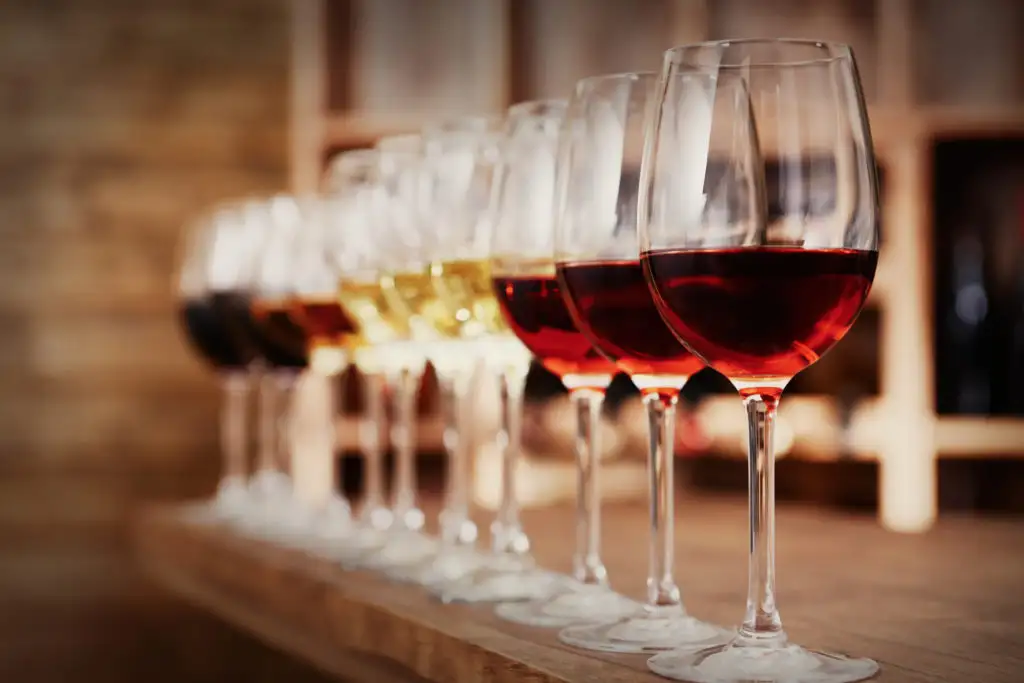 Row of glasses of red and white wine