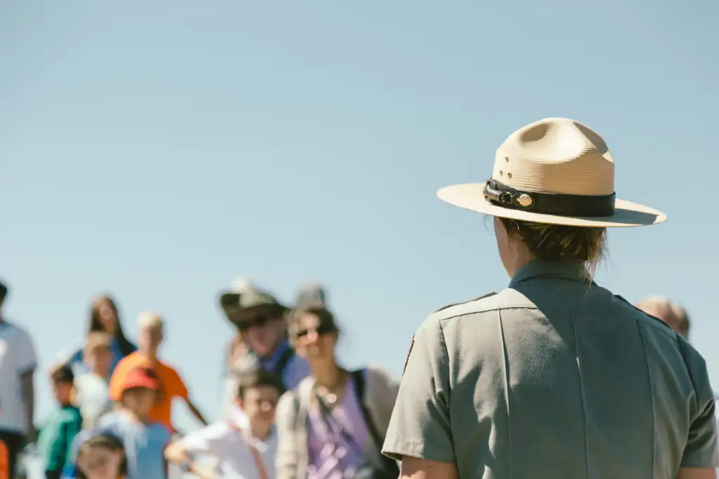 National park ranger giving a talk to a listening crowd