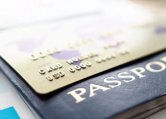 Close up of credit card on top of a passport