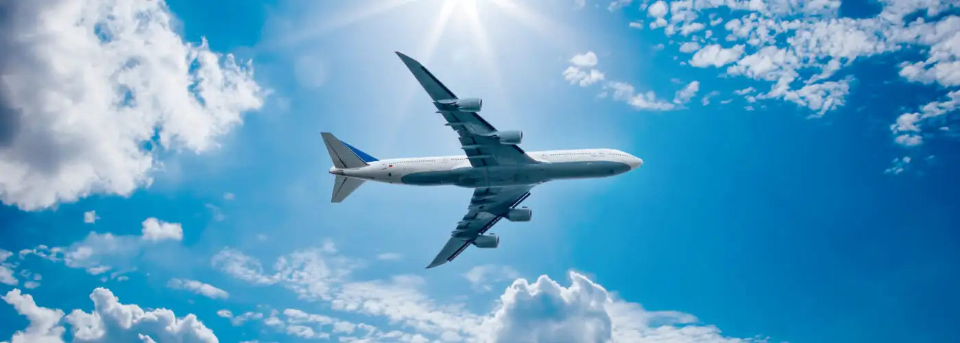 Airplane flying through a blue sky