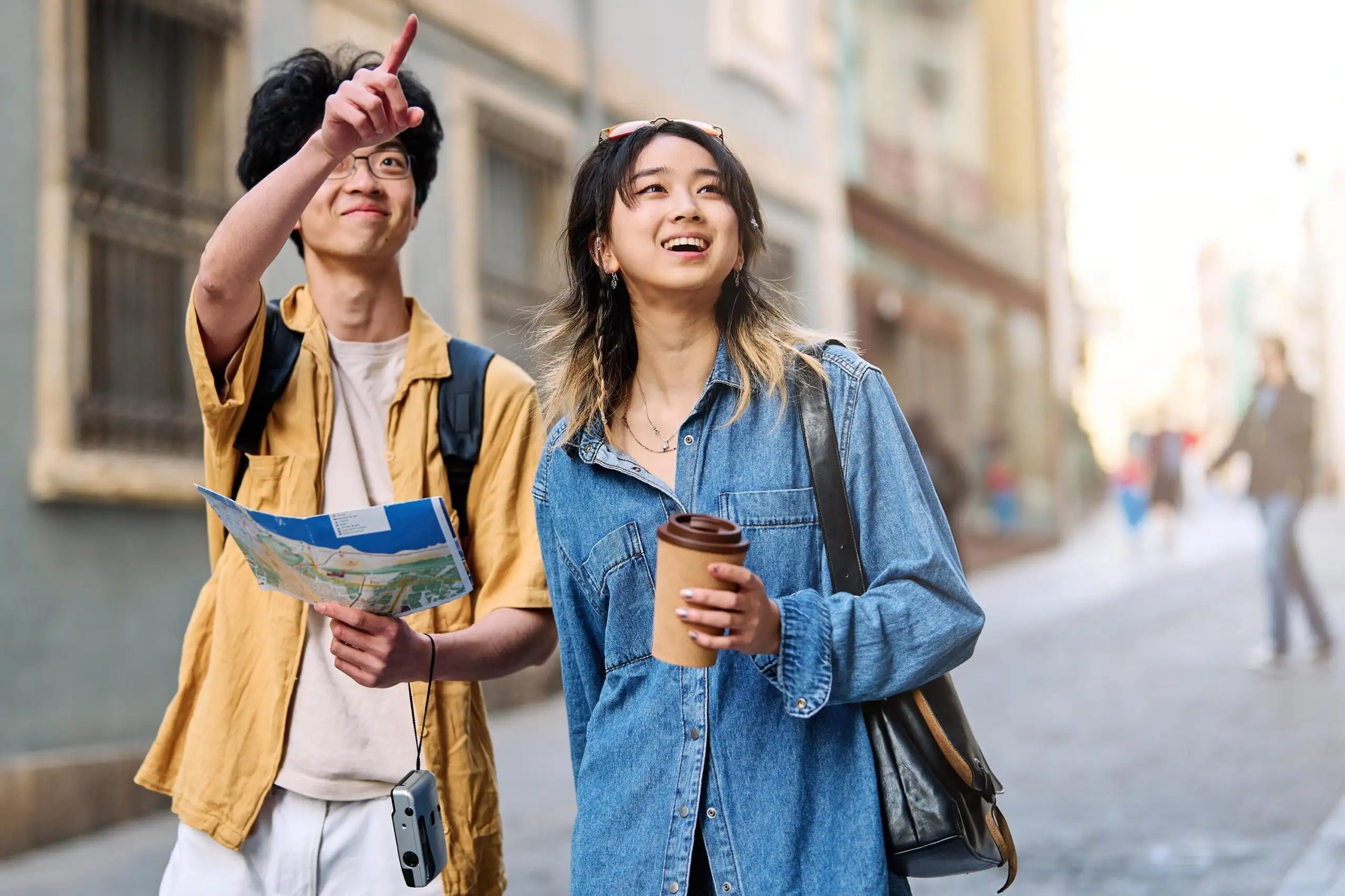 Couple navigating a city with map