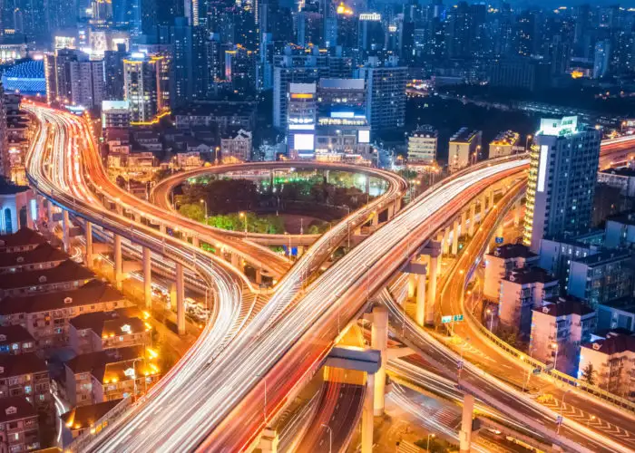 Aerial view of a long exposure shot of city traffic at night