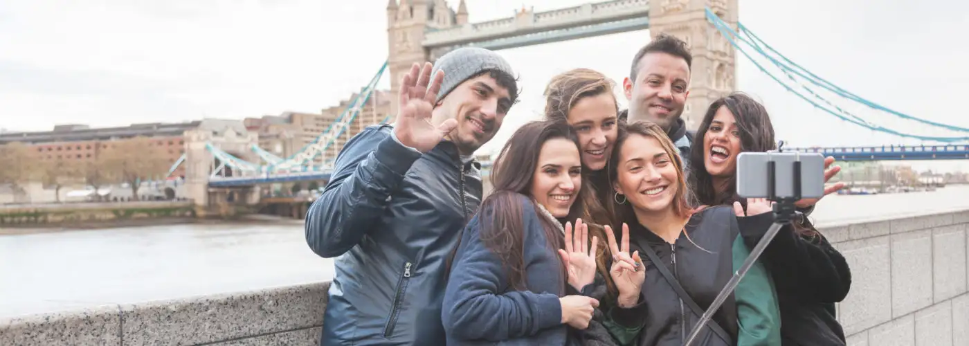 Group of friends taking a selfie in front of the Tower of London