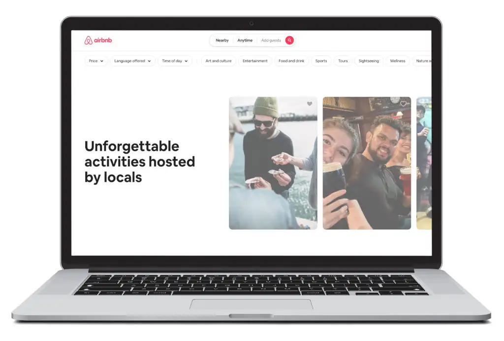 Laptop showing the homescreen of Airbnb Experiences, a ticket and excursion booking website
