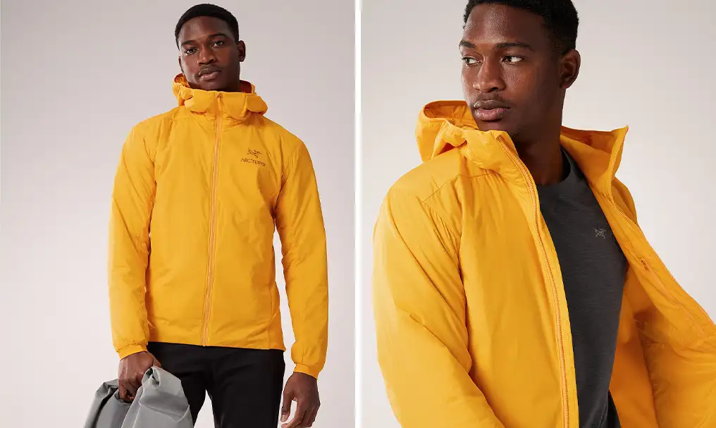 Model wearing the Arc'teryx Men's Atom Hoody in bright yellow