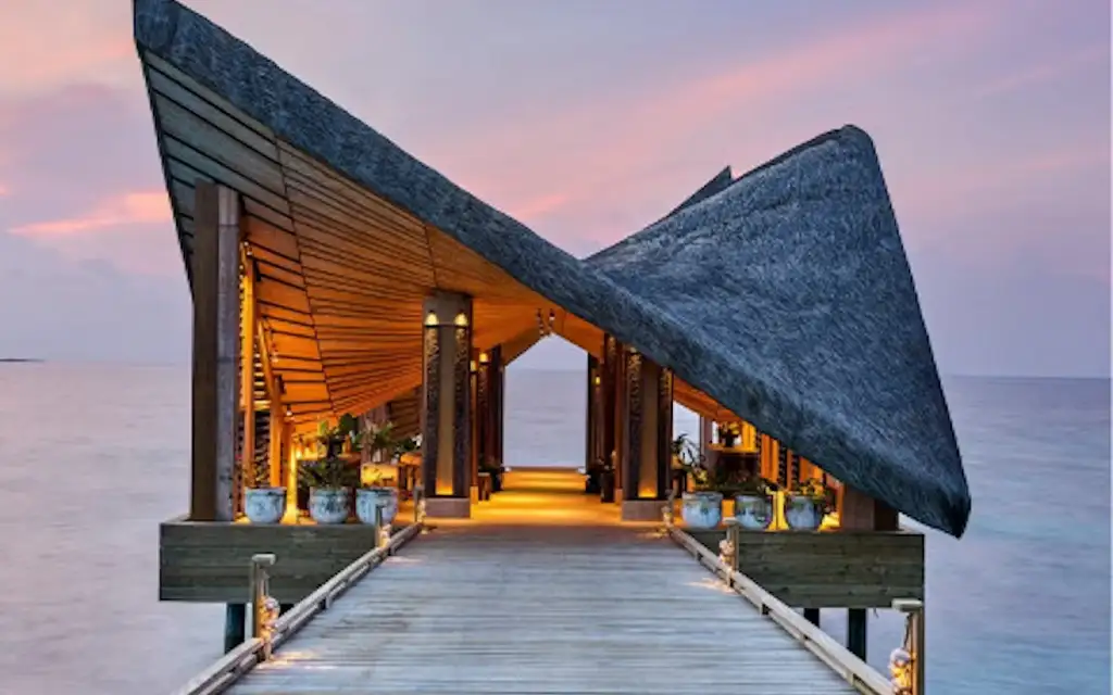 Overwater bungalow at dusk