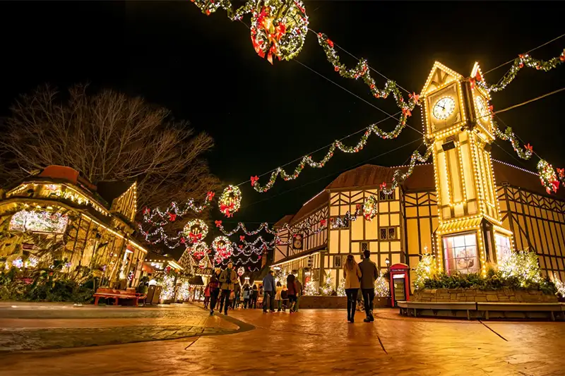 People exploring the Christmas Town holiday lights pop-up at Busch Gardens