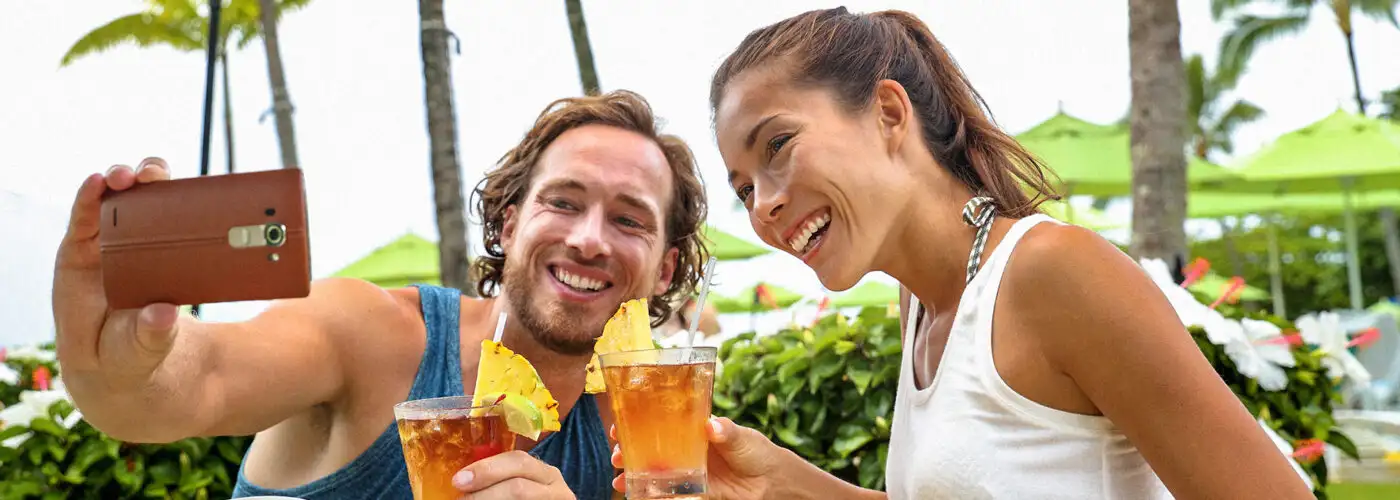 couple toasting cheers with alcoholic hawaiian drinks, Mai Tai, Hawaii