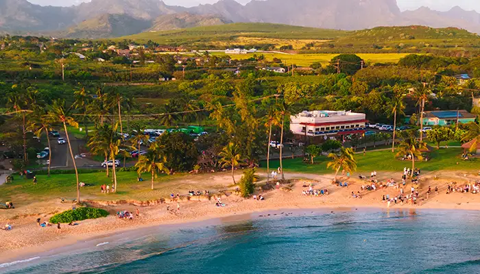 Aerial of Poipu beach during sunset in Kauai Hawaii USA