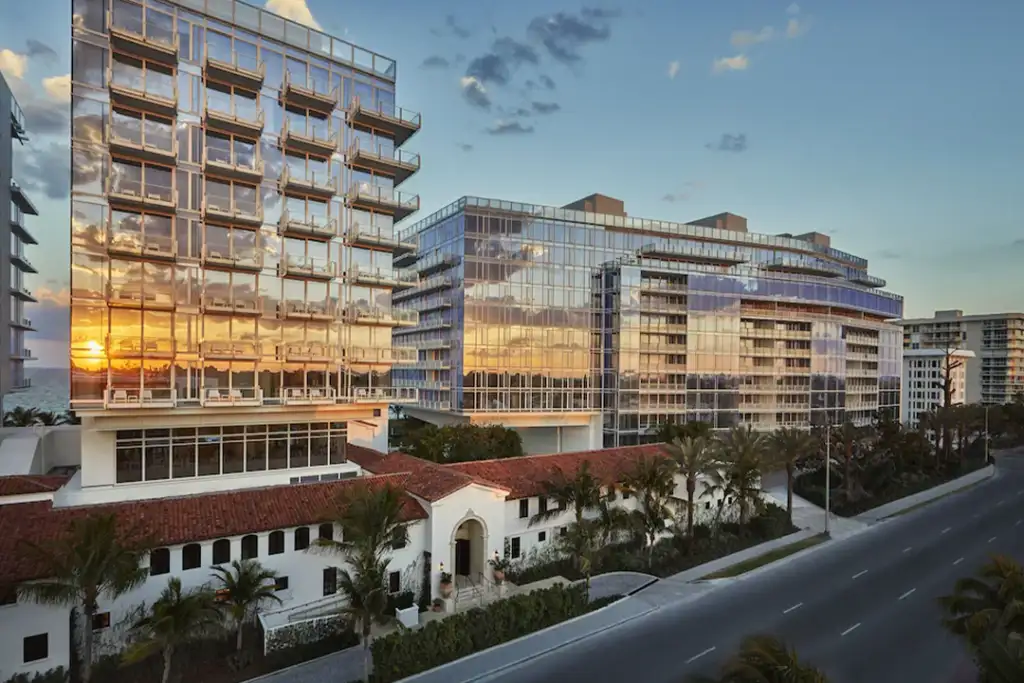 Aerial view of the Four Seasons Hotel at The Surf Club with the sunset reflecting off the buildings