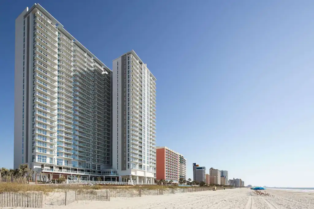 Exterior of the Hilton Grand Vacations Club Ocean Enclave Myrtle Beach looking up from the beach