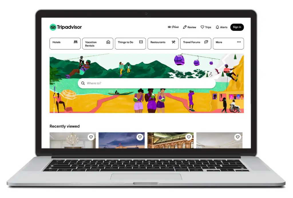 Open laptop showing home screen of Tripadvisor, a site where you can book hotels and see user images of site bookings