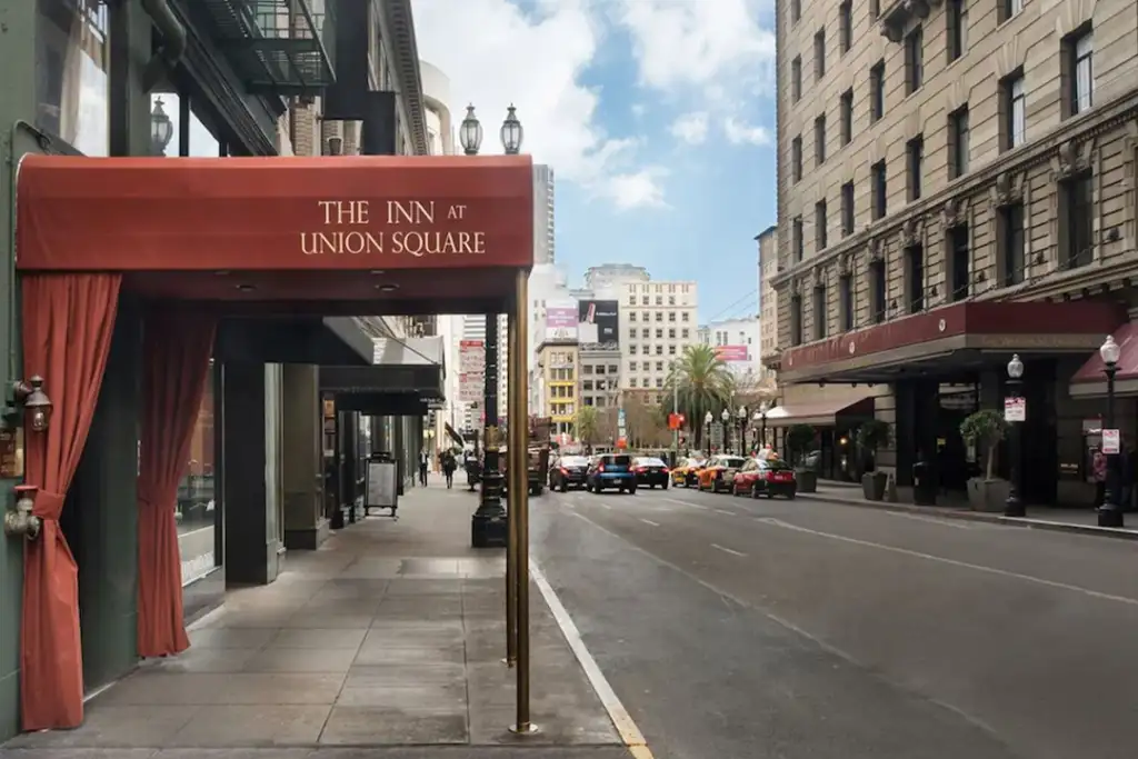 Front entrance of the Inn At Union Square on the left while looking down the street