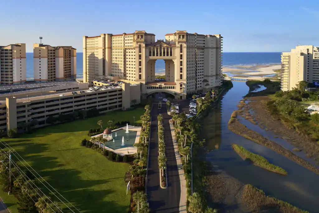 Aerial view of the North Beach Resort & Villas from the from with the beach and ocean in the background