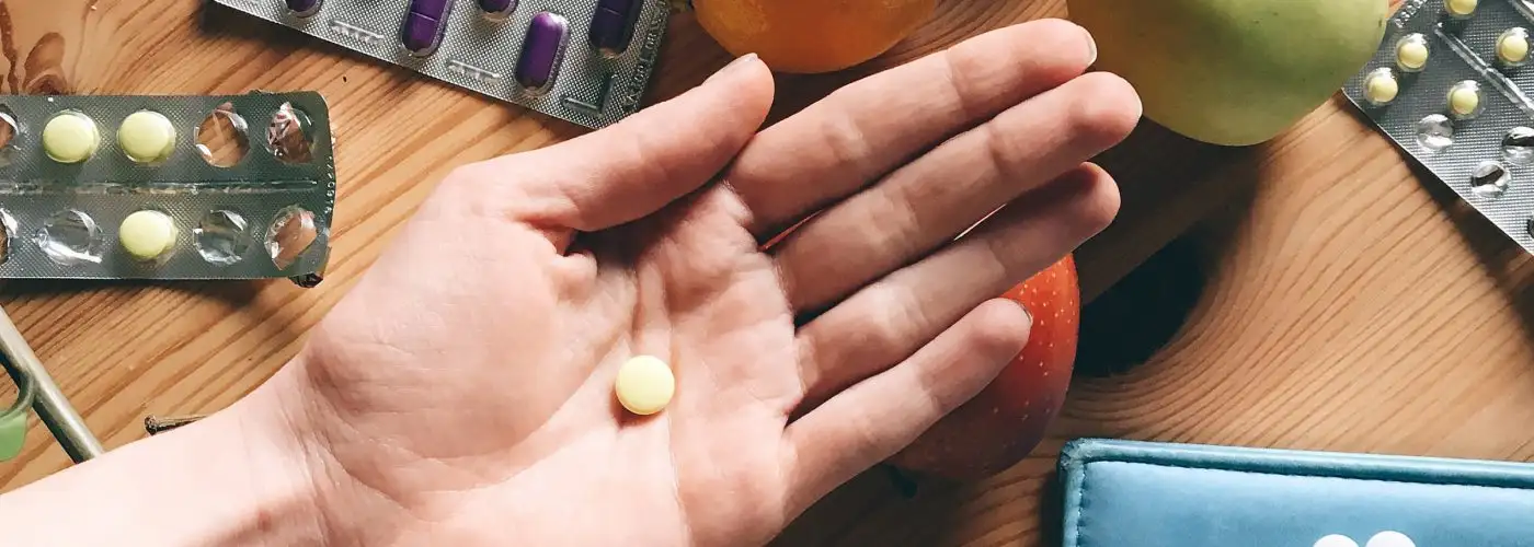 hand holding pill