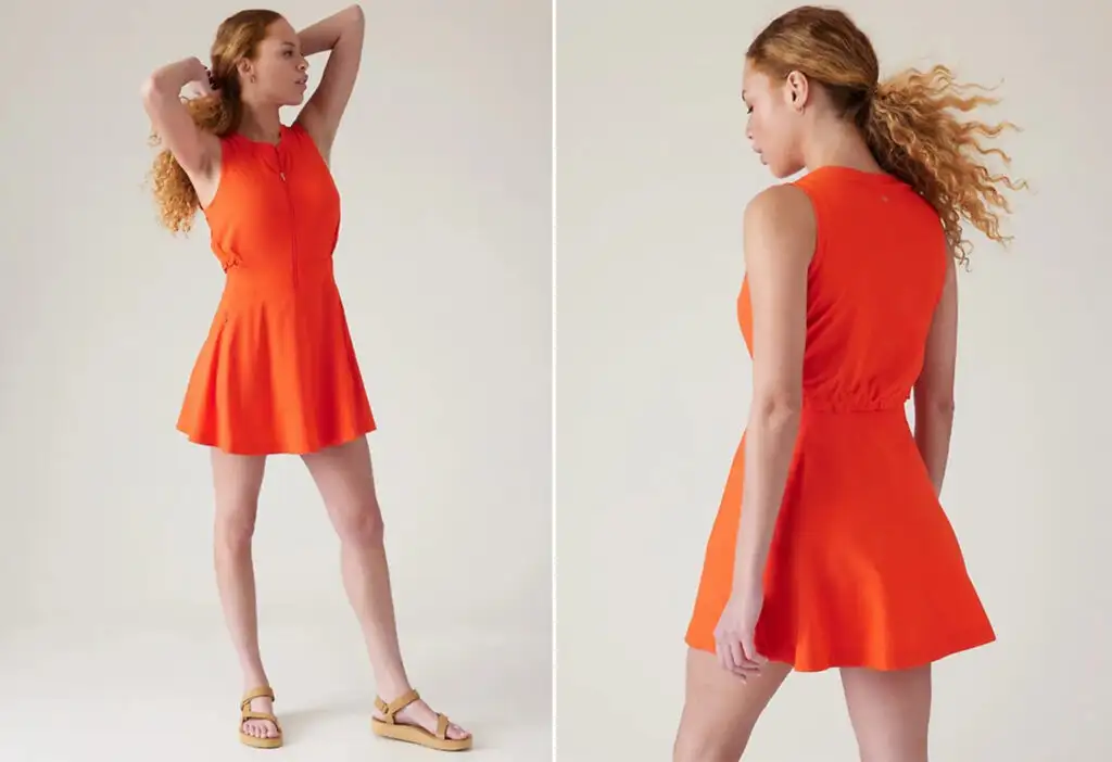 Model showing two angles of the Match Point Dress in vermillion