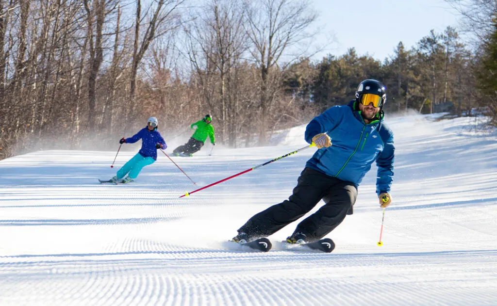 3 people skiing Cranmore Mountain