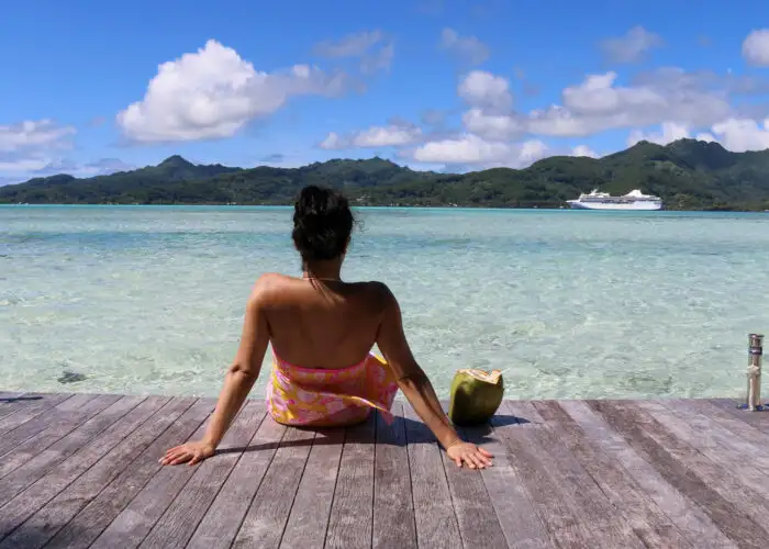 woma sits on dock in tahiti