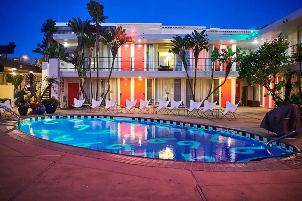 View of The Phoenix Hotel's pool and palm trees within the inner courtyard