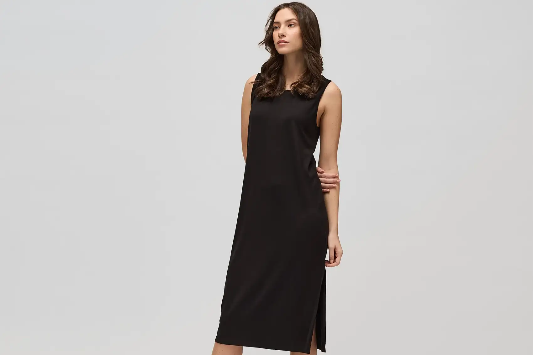 Female model wearing long black dress