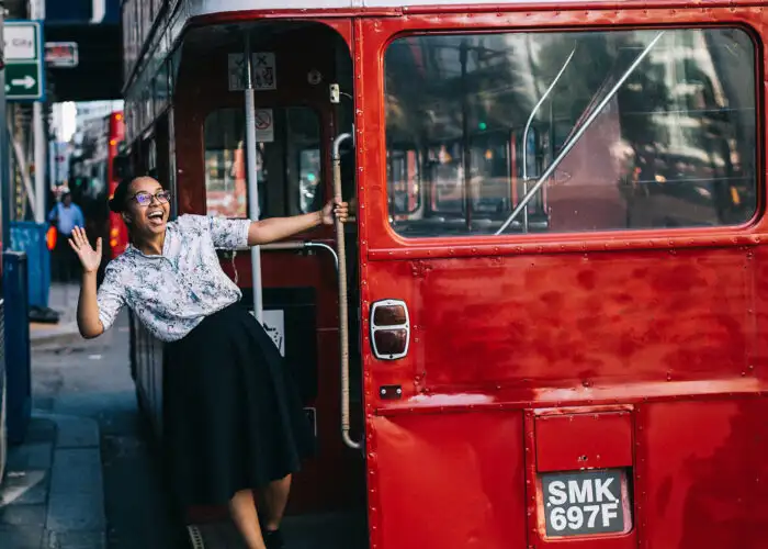 woman hopping on london bus