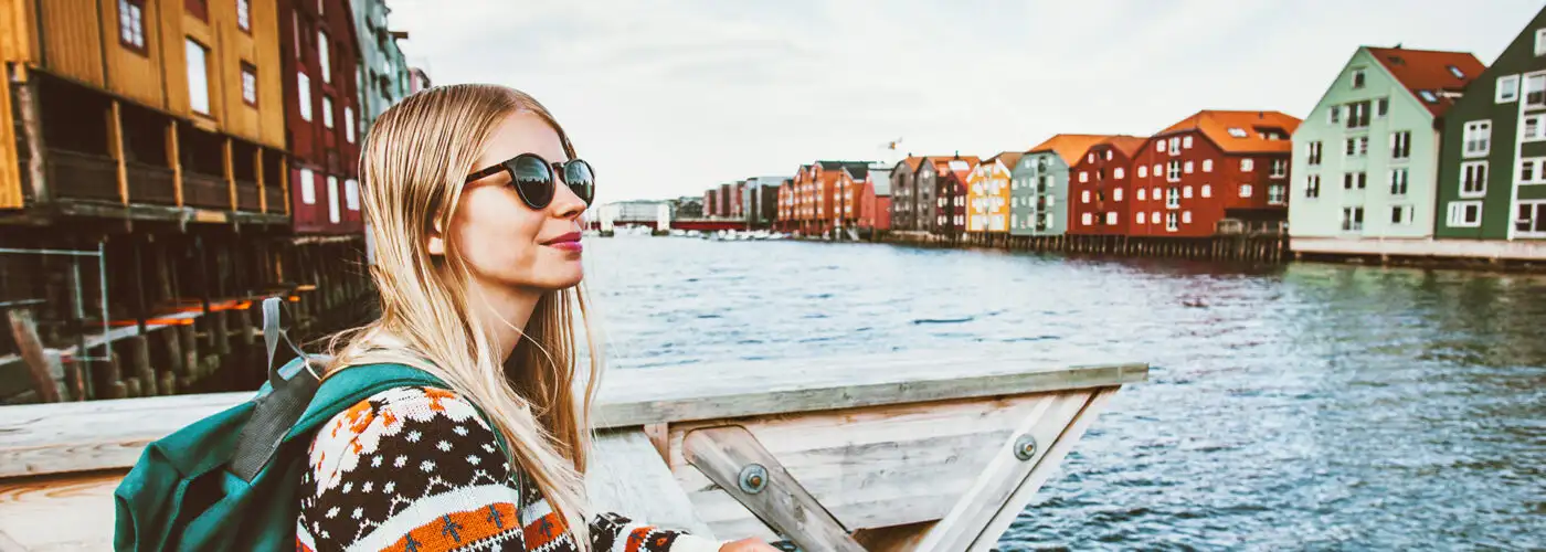 blonde woman traveling in Trondheim city Norway